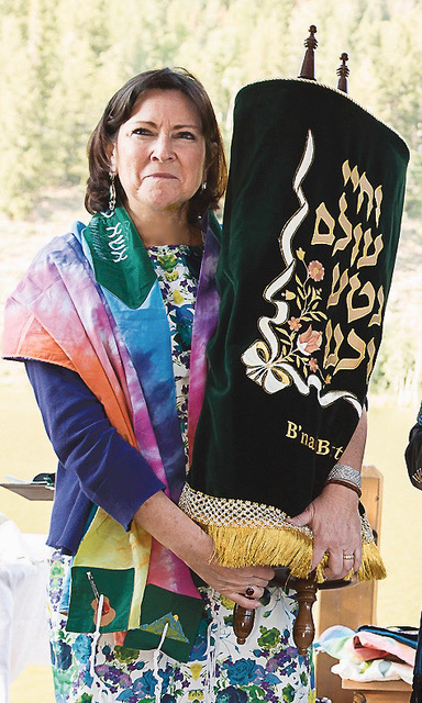 Rabbi Robbi Sherwin holding Torah